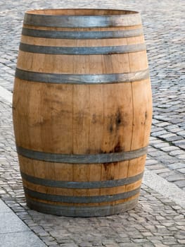 Single wooden barrel on the sidewalk in Lutherstadt Wittenberg.