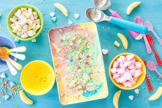 Colorful ice cream with sugar sprinkles and marshmallows