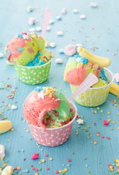 Colorful ice cream with sugar sprinkles and marshmallows