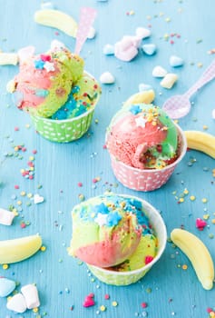 Colorful ice cream with sugar sprinkles and marshmallows