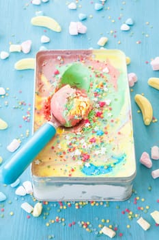 Colorful ice cream with sugar sprinkles and marshmallows