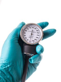 Hand with green protective glove holding an Blood pressure gauge, isolated on white background