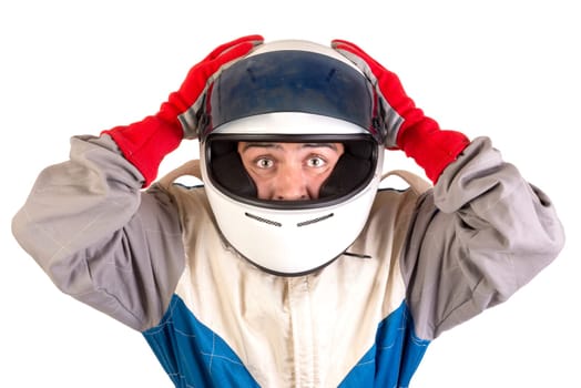 Racing driver posing with helmet isolated in white