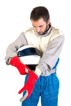 Racing driver posing with helmet isolated in white