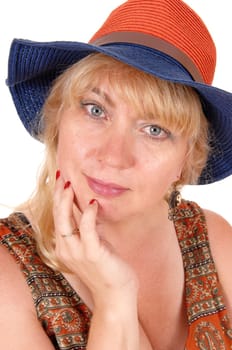 A beautiful face of a woman in a closeup image with her hand on her.chin and wearing a hat, isolated for white background..