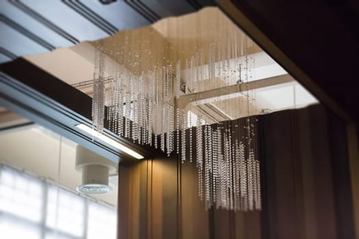 Crystal Line Mobiles Chandelier From Ceiling, stock photo