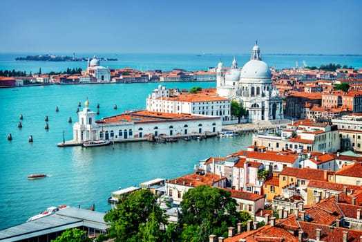 Beautiful view of the Grand Canal and Basilica Santa Maria della Salute in the late evening with very interesting clouds, Venice, Italy