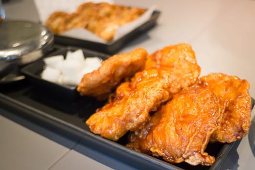 Korean Fried Chicken On Black Plate, stock photo