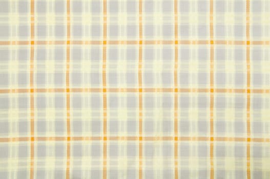 Close up seamless checked yellow fabric pattern texture background.