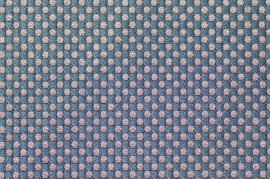 Close up checked woven woolen rug fabric pattern background.