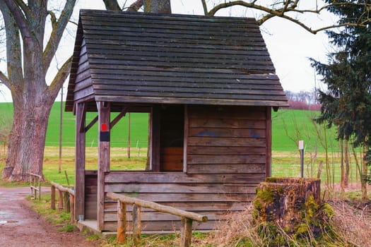 Old wooden hut to protect against wind,rain or snow at a pond near the town of Heiligenhaus in Germany.