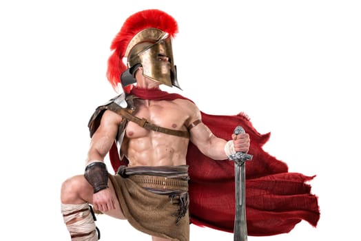 Ancient warrior or Gladiator posing over a white background