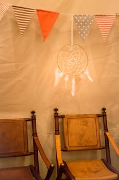 Multi colored triangle flags hanging indoor party, stock photo