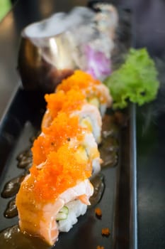 Salmon Sushi Served On Black Plate, stock poto