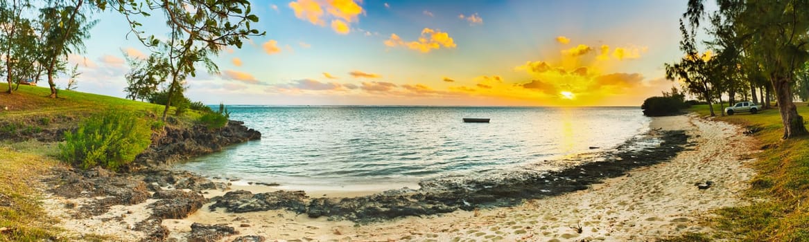 White sandy beach at sunset. Mauritius. Panorama