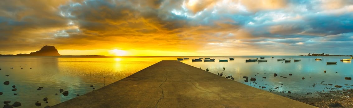 Sunset over sea. Le Morn Brabant on background. Mauritius. Panorama
