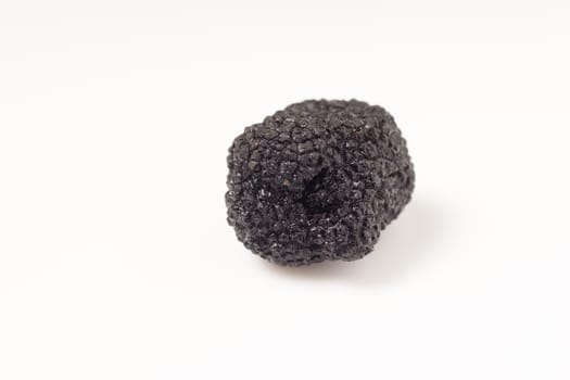 Delicate exclusive black truffles, isolated on white background