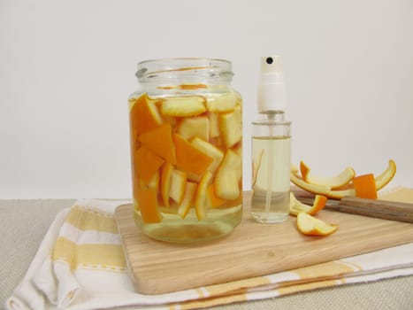 Ecological orange cleaner with orange peel and vinegar in the spray bottle