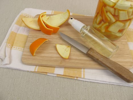 Ecological orange cleaner with orange peel and vinegar in the spray bottle