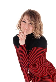 A blond happy woman standing bending forward with her finger over.her mouth and smiling, isolated for white background..