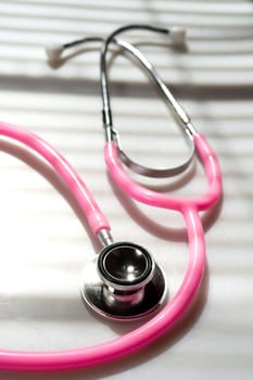 Window light washed over a Stethoscope in the doctors office