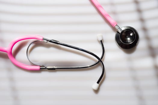 Window light washed over a Stethoscope in the doctors office