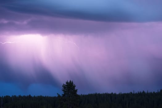 A storm passes thru quickly over Norris Canyone Road in Yellowstone