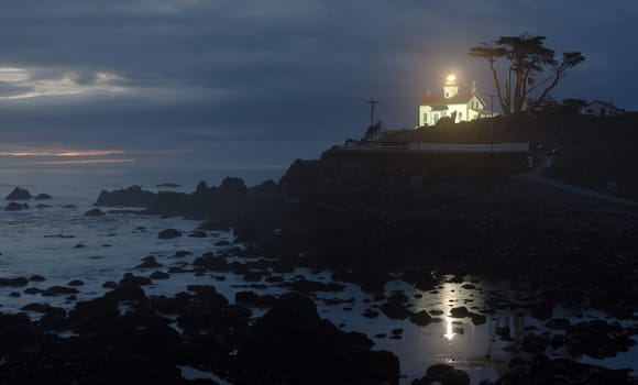Night falls on a rocky outcropping in Crescent City