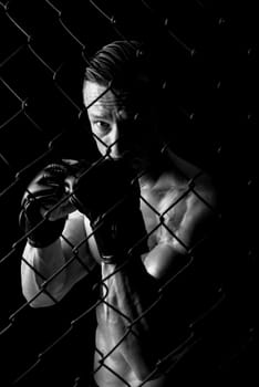 Strong Mixed Martial Arts fighter inside the cage