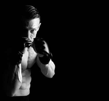 Strong Mixed Martial Arts fighter isolated in black