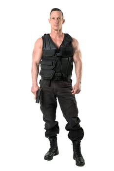 Man with tactical vest and gun isolated in white