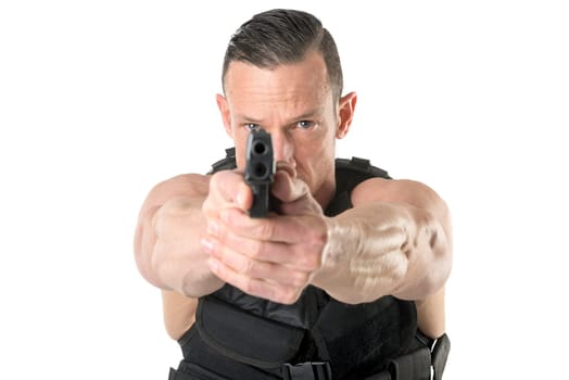 Man with tactical vest and gun isolated in white