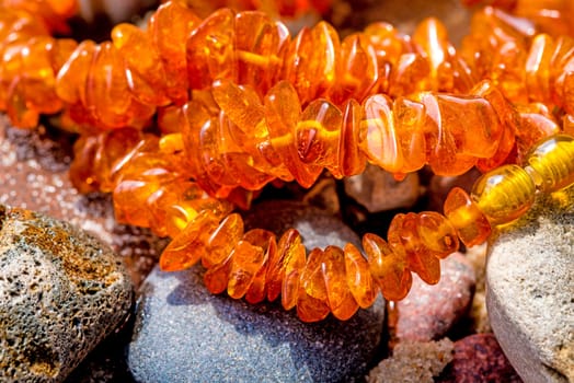 Amber chain on the Baltic Sea beach.