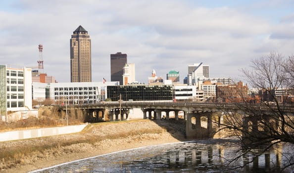 The Des Moines river running with ice chunks travel through downtown