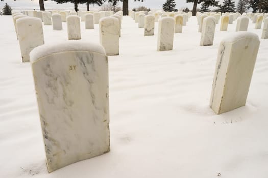 Snow covered the ground and tops of markers where military veterans are buried at Little Big Horn