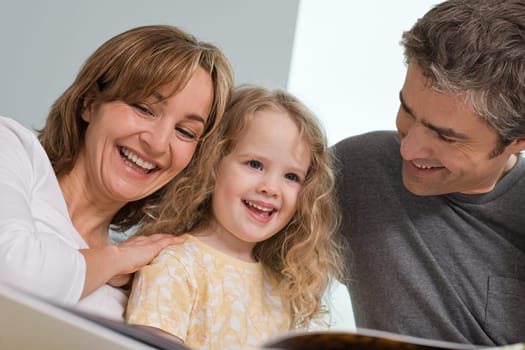 family reading a book