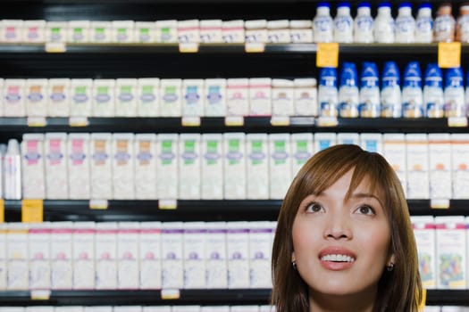 Young woman shopping in a supermarket