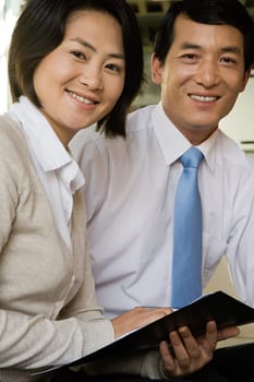 Two Chinese business colleagues