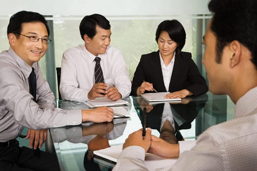 Chinese businesspeople in a meeting