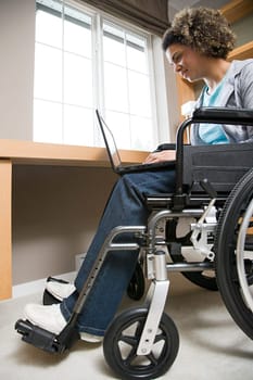 Disabled woman using a laptop computer