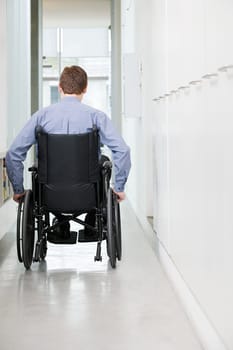 Rear view of a man in a wheelchair