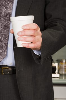 Businessman holding coffee cup