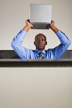 Businessman holding up a box