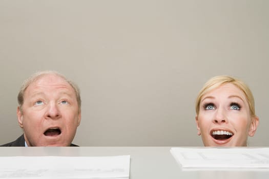 Office workers looking up in surprise