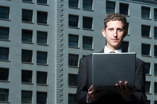 Man holding a laptop computer
