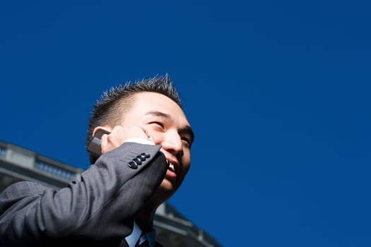 Young businessman on mobile phone