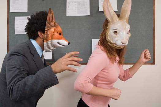 Office workers fooling around in masks