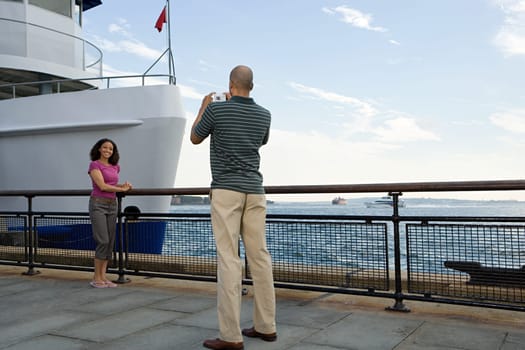 Man photographing woman