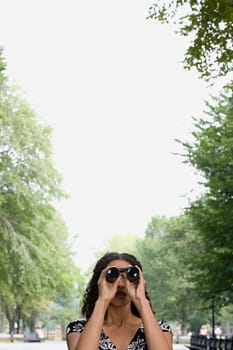 Woman looking through binoculars
