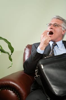 Man using breath freshener